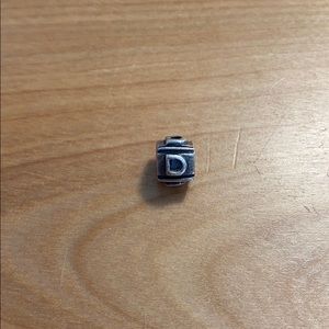 Sterling silver “D” charm